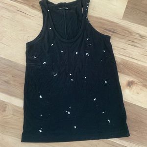A black silky tank top with specks of white